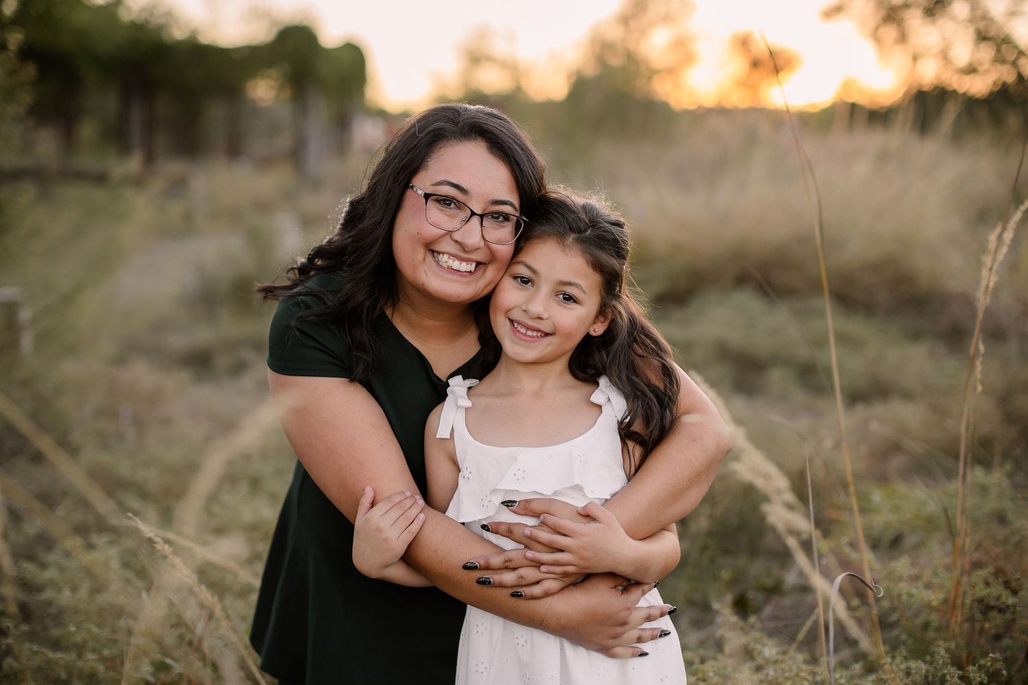 Candid outdoor family portrait series in autumn setting with natural lighting and warm earth tones. San Antonio family Photographer