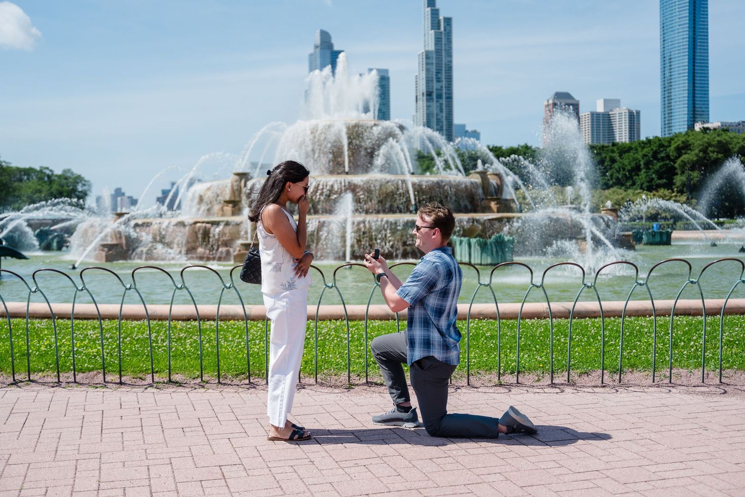Sequence of photos showing people enjoying the iconic Buckingham Fountain in Chicago's Grant Park on a sunny summer day.