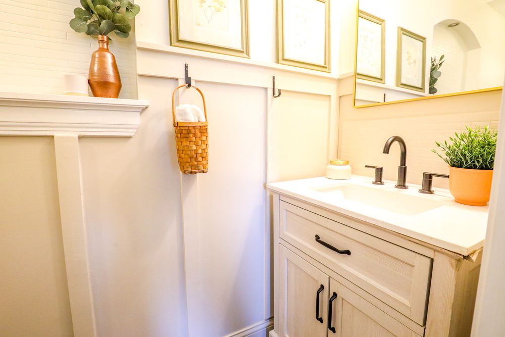 Modern white bathroom renovation featuring clean lines, subway tile, and natural light from multiple angles.