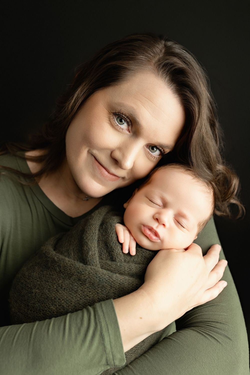 Mom is holding a newborn boy. - Greenville, SC newborn photographer - Easley, SC newborn photographer.