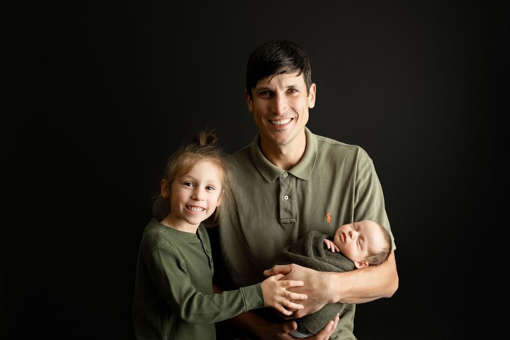 Dad and big brother holding newborn boy. - Greenville, SC newborn photographer - Easley, SC newborn photographer.