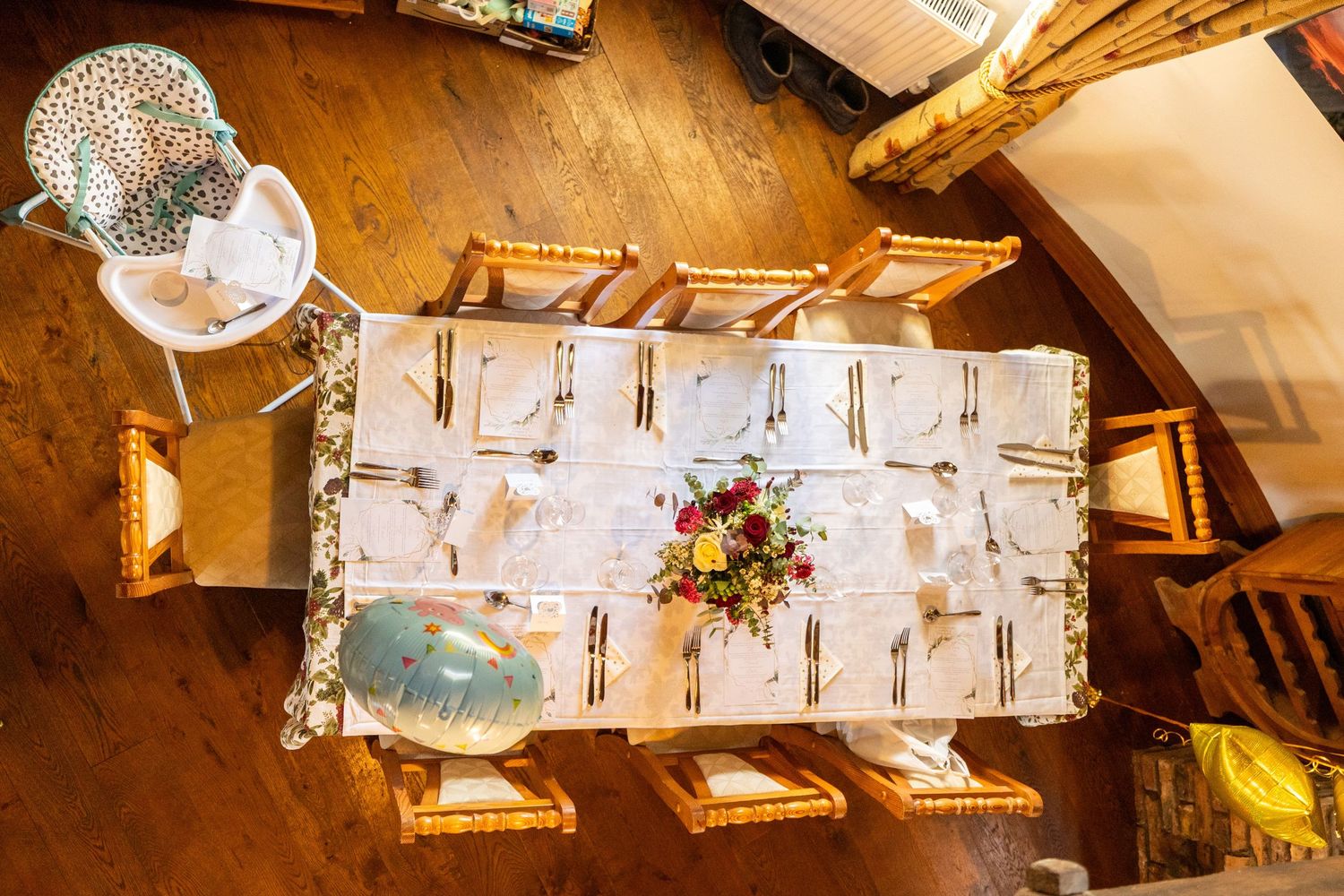 aerial view of an empty table at a wedding before the bridal party sit down taken from above on a balcony at the windmill, burscough