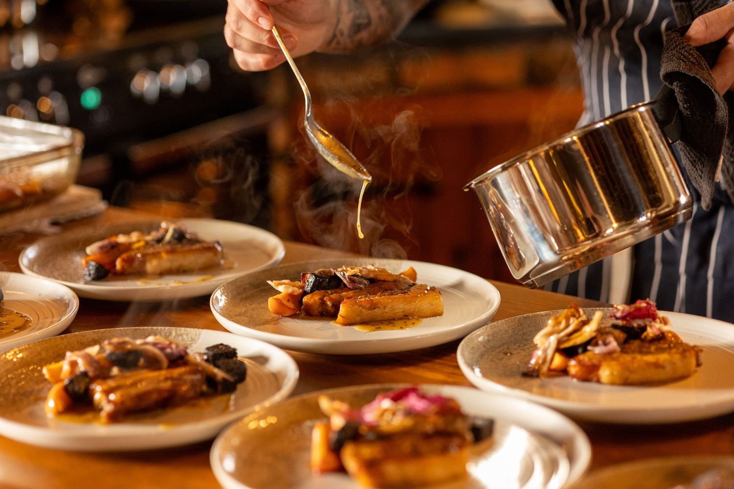 Detail shot of sauce being added to starter at The Windmill Burscough, relaxed documentary wedding photography