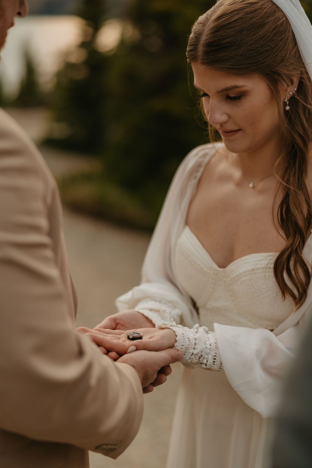 Glacier National Park Eloping Bride and Groom praying over their wedding rings during their elopement in Glacier by Elopement Photographer