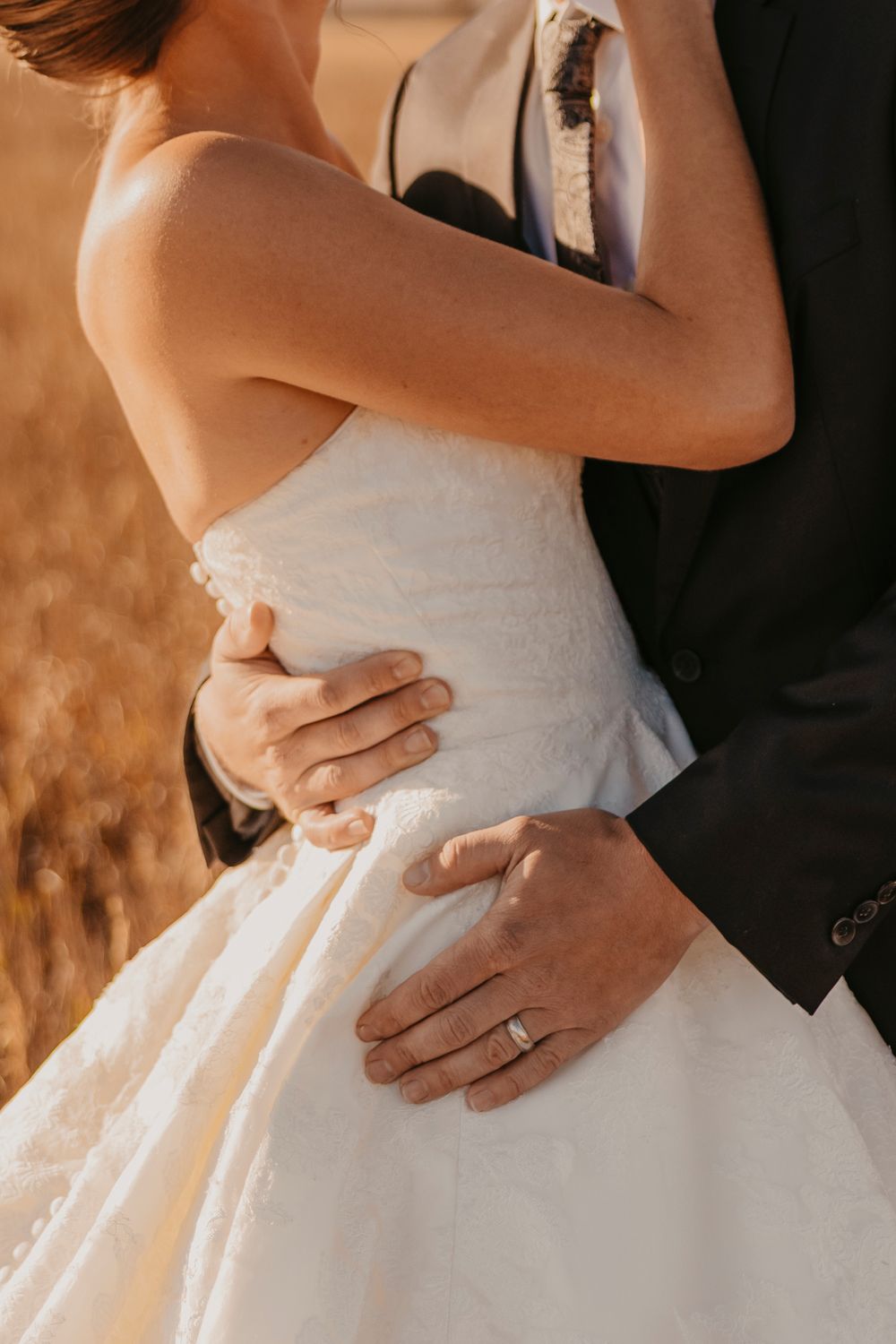 Bride and Groom wrapped in on each other captured by a Grand Teton National Park Elopement Photographer at Mormon Row