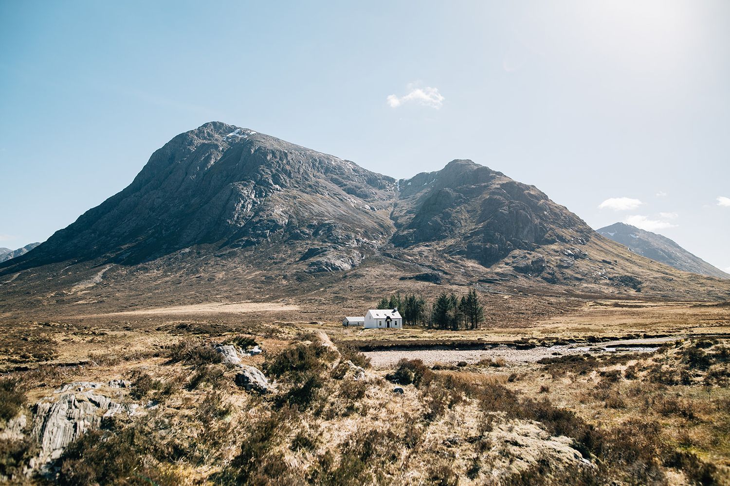 A panoramic view of rugged mountain peaks and valleys in a remote wilderness landscape.