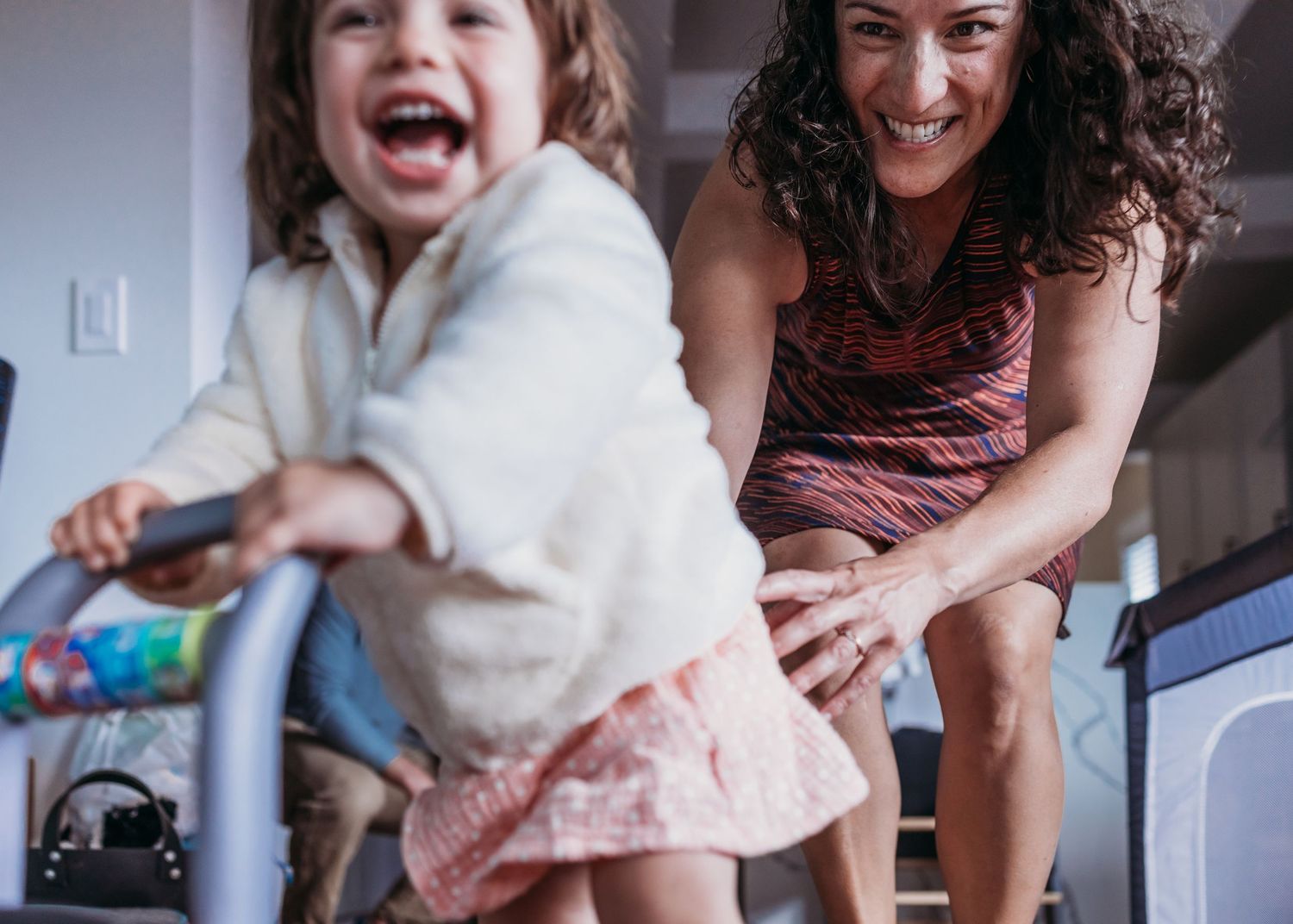 A series of candid moments showing laughter and joy between people sitting together at home.