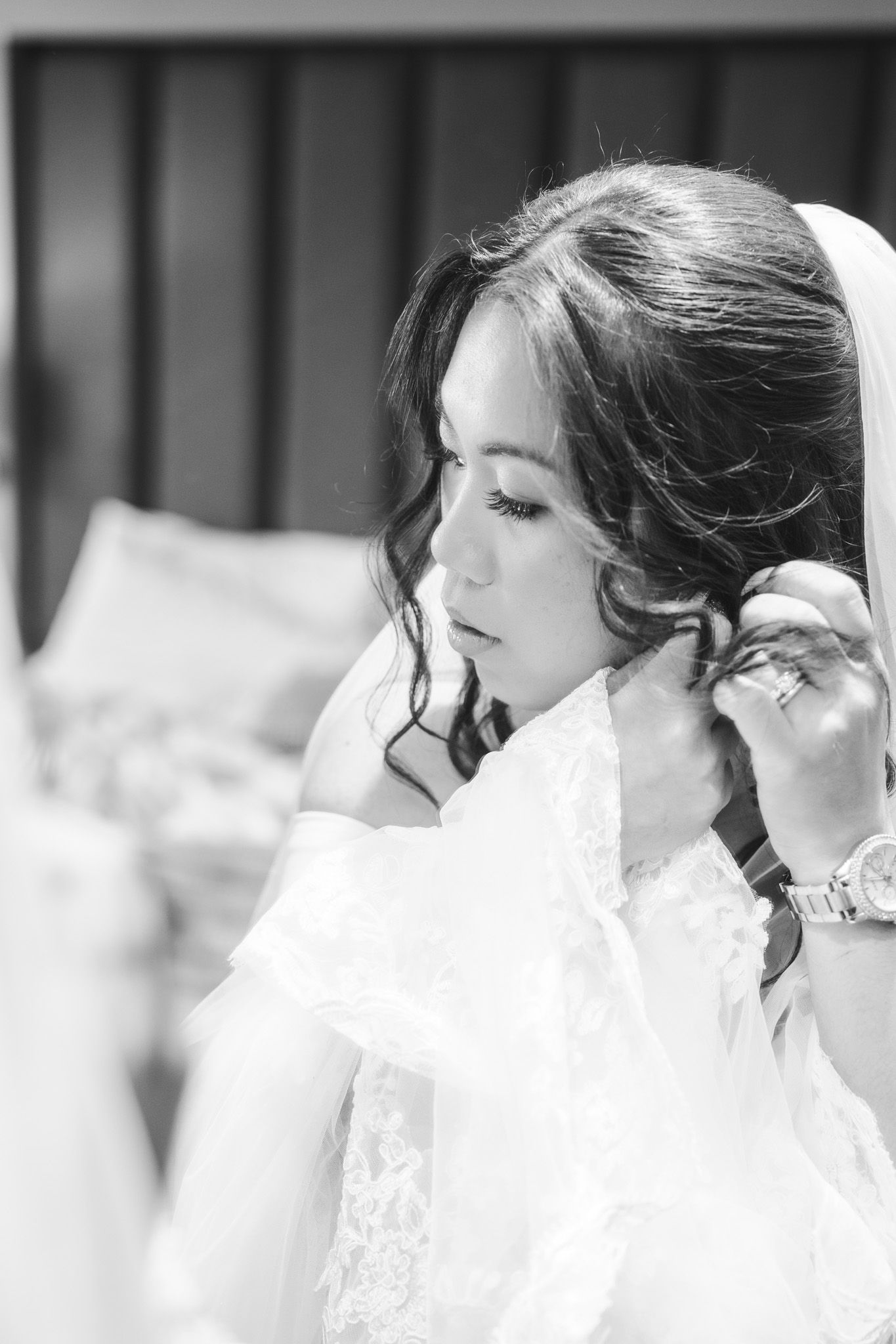 Bride preparing for Gibraltar wedding, putting in earings