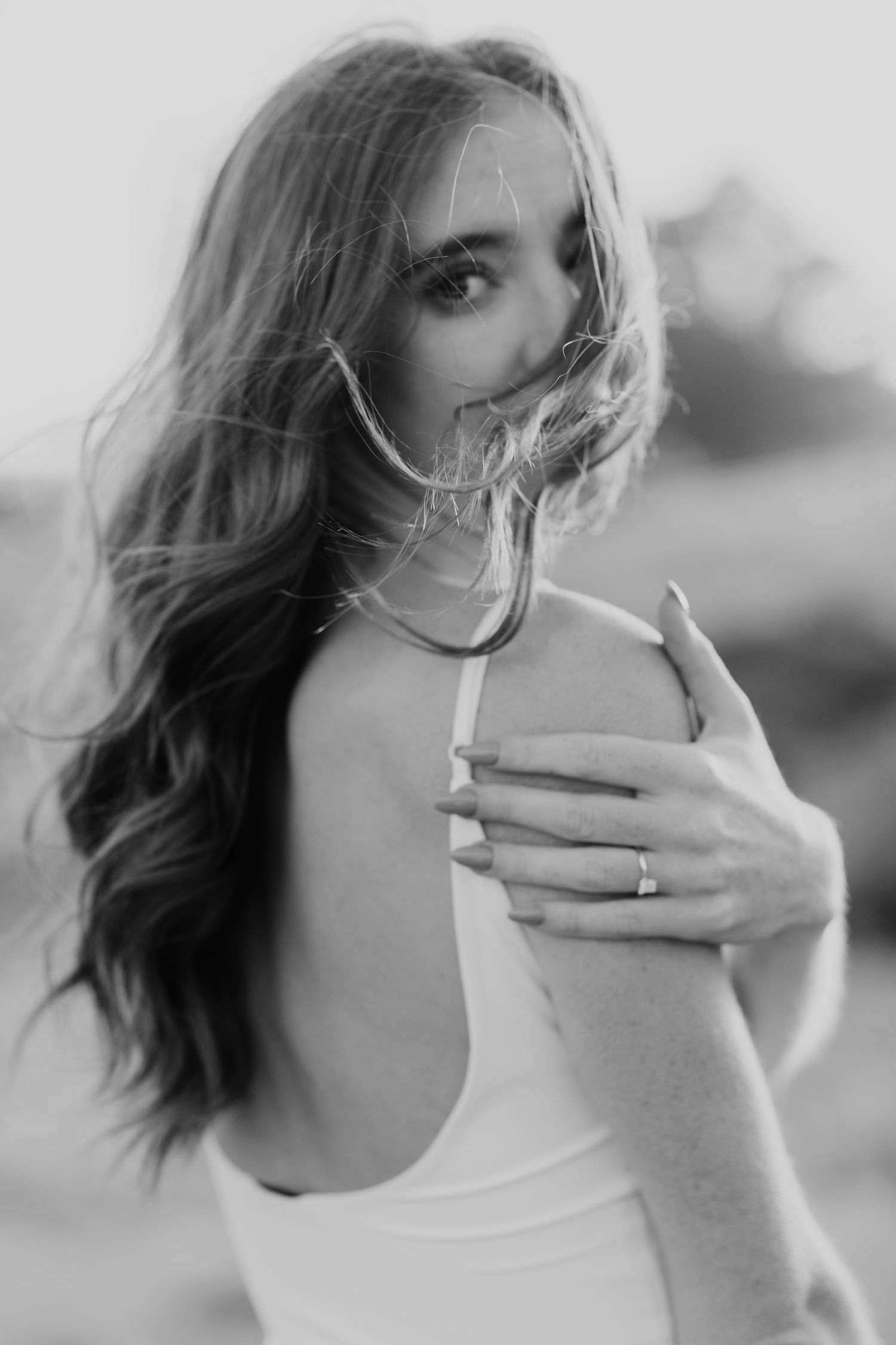 Black and white artistic portrait series showing a person smoking a cigarette in various poses against a plain background.