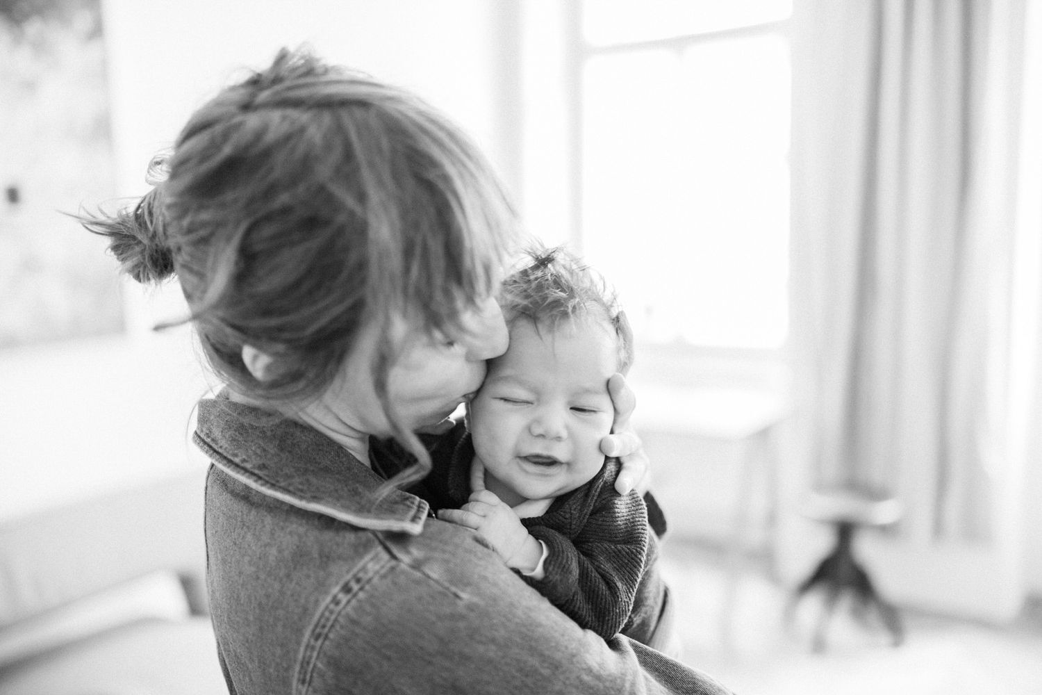 A tender black and white portrait capturing an intimate moment.