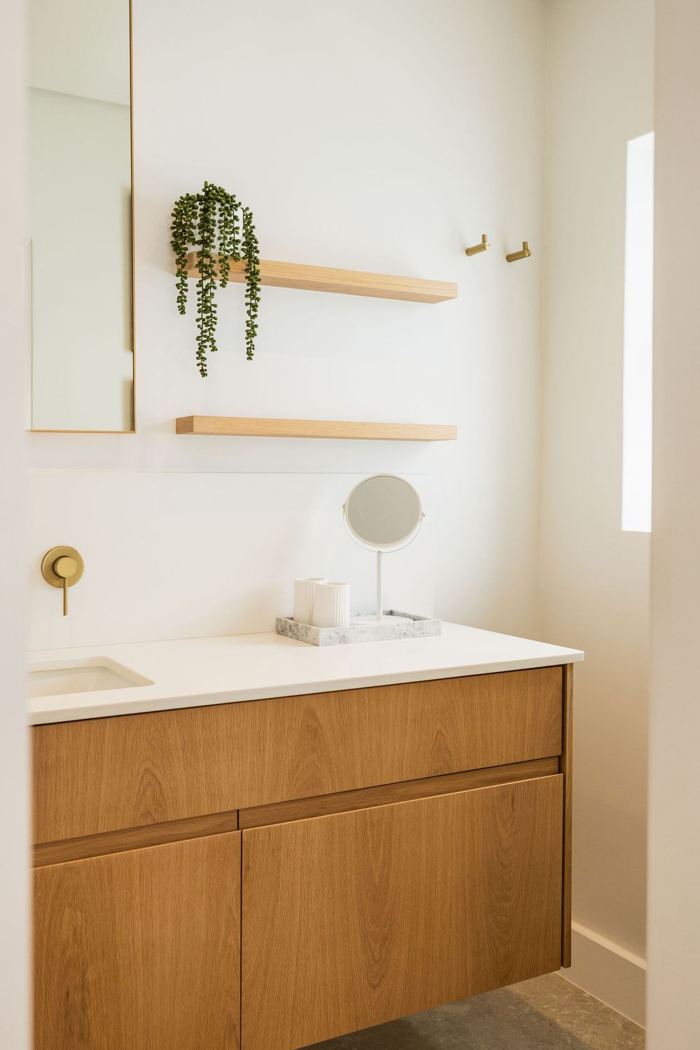 Minimal Airbnb bathroom with soft lighting and contemporary design
