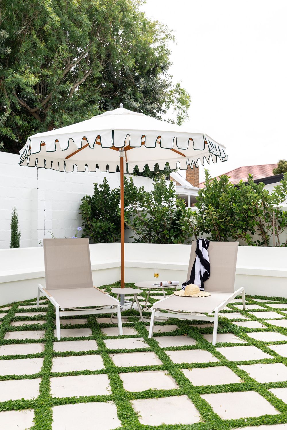 Poolside lounge at modern Airbnb with indoor-outdoor lifestyle design