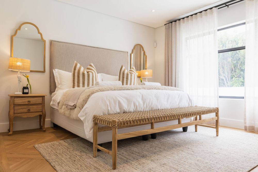 Minimalist Airbnb bedroom with calming neutral palette and natural light