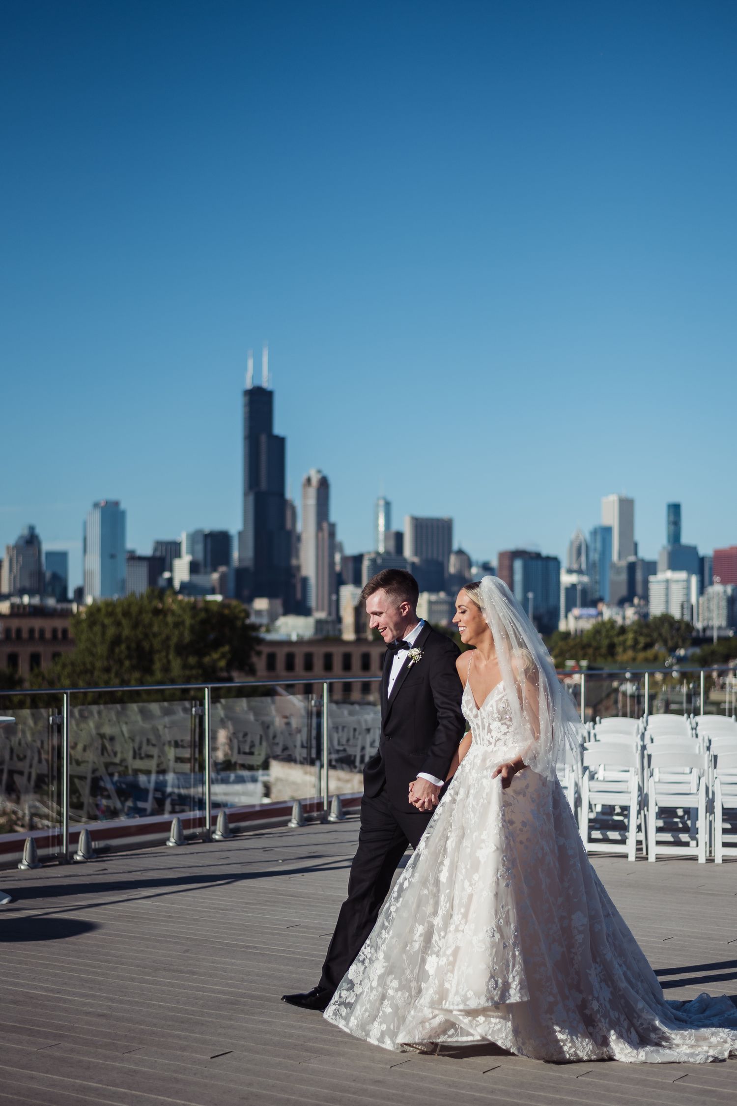 A romantic rooftop wedding photoshoot with the Chicago skyline creating a stunning urban backdrop.