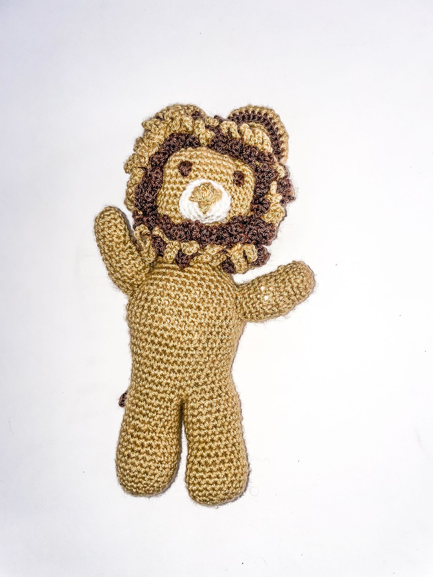 Handmade tan crocheted lion plush toy with mane detail shown from various angles.
