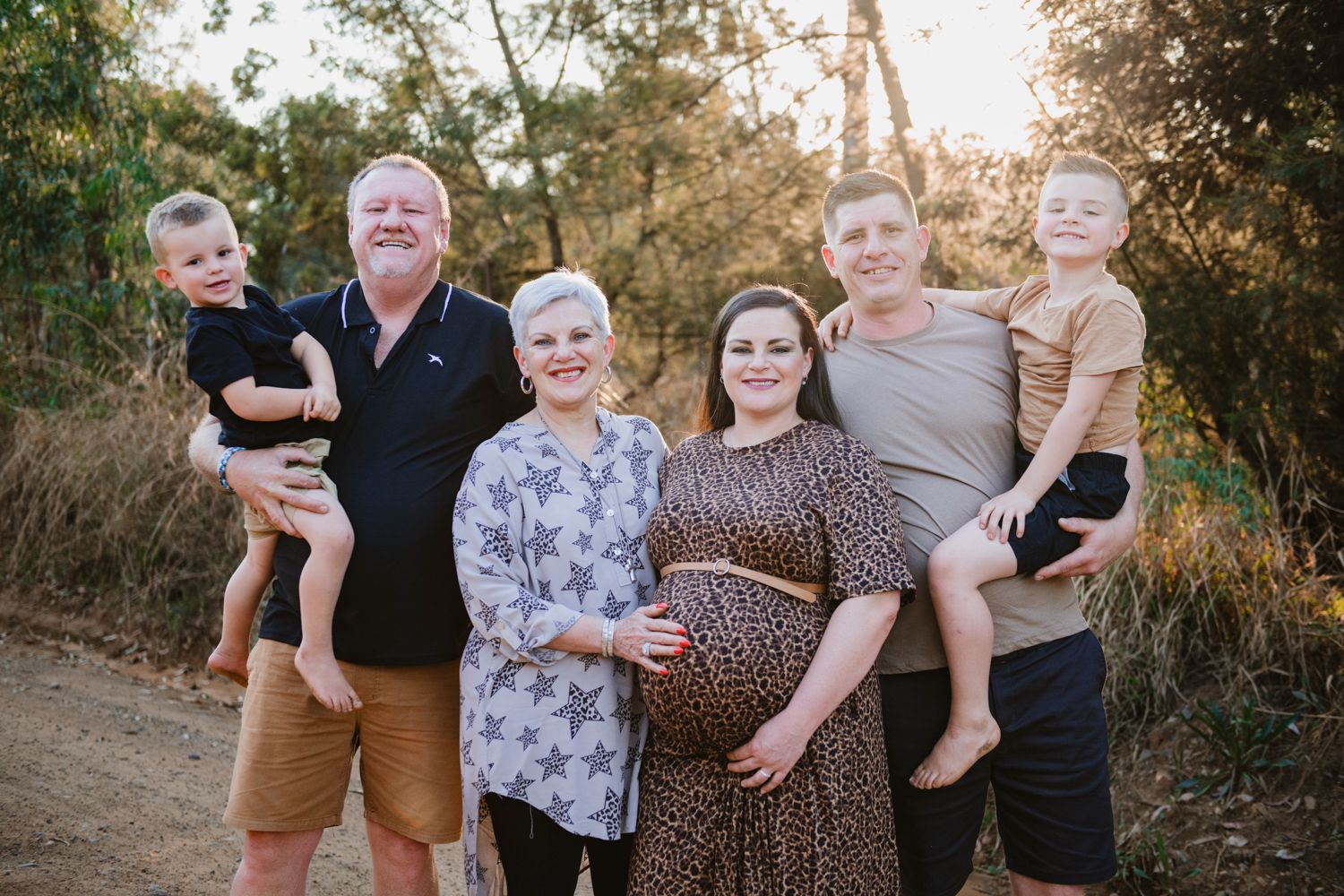 Whole family posing together during a professional maternity photoshoot in Gauteng.