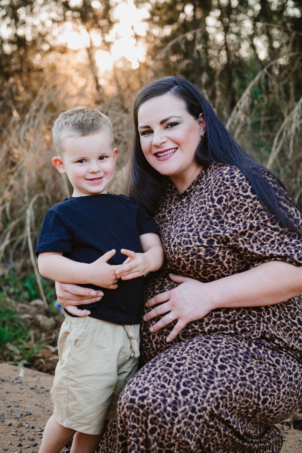 Intimate portrait of parents-to-be embracing during a maternity photoshoot.