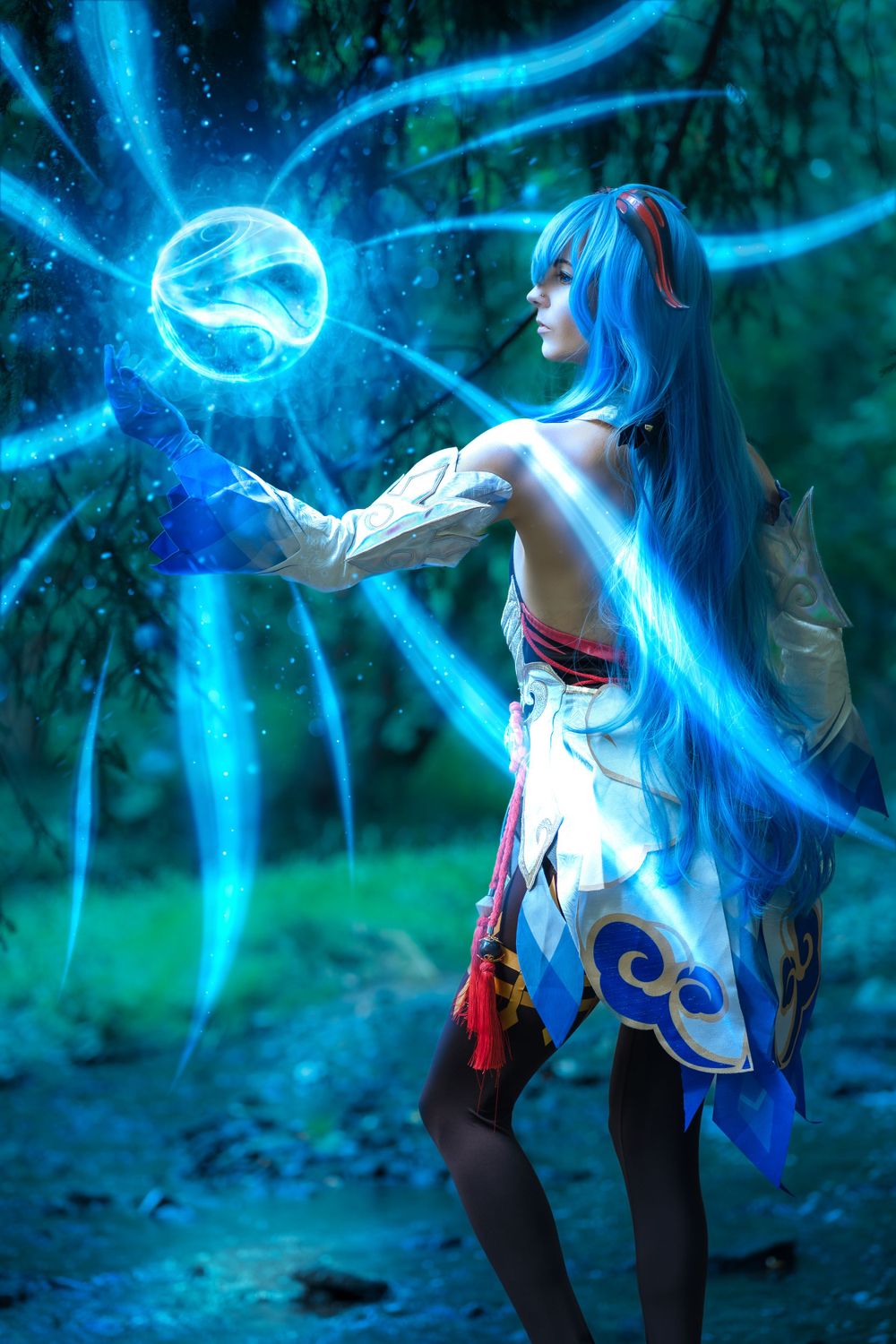 Cosplay portrait of Ganyu from Genshin Impact casting Cryo magic in a glowing forest.