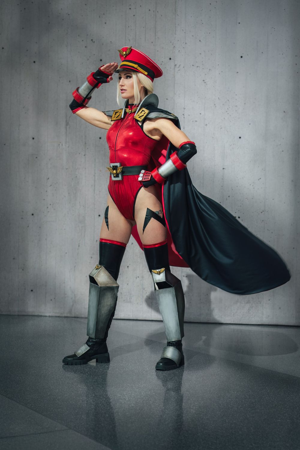 Cammy Bison cosplayer striking a confident pose.