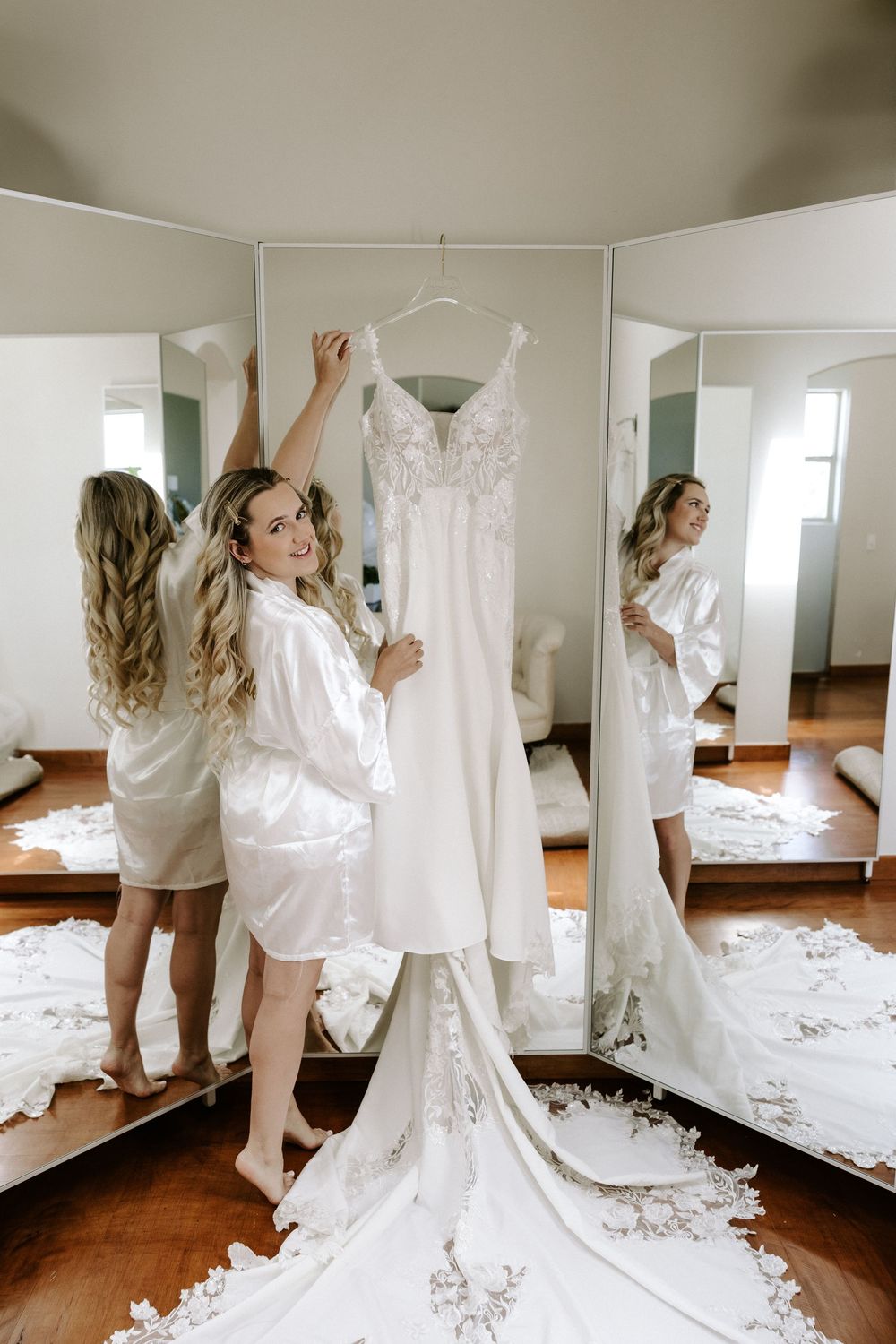 Series of photos showing someone hanging a white wedding dress in front of a mirror in a sunlit room.