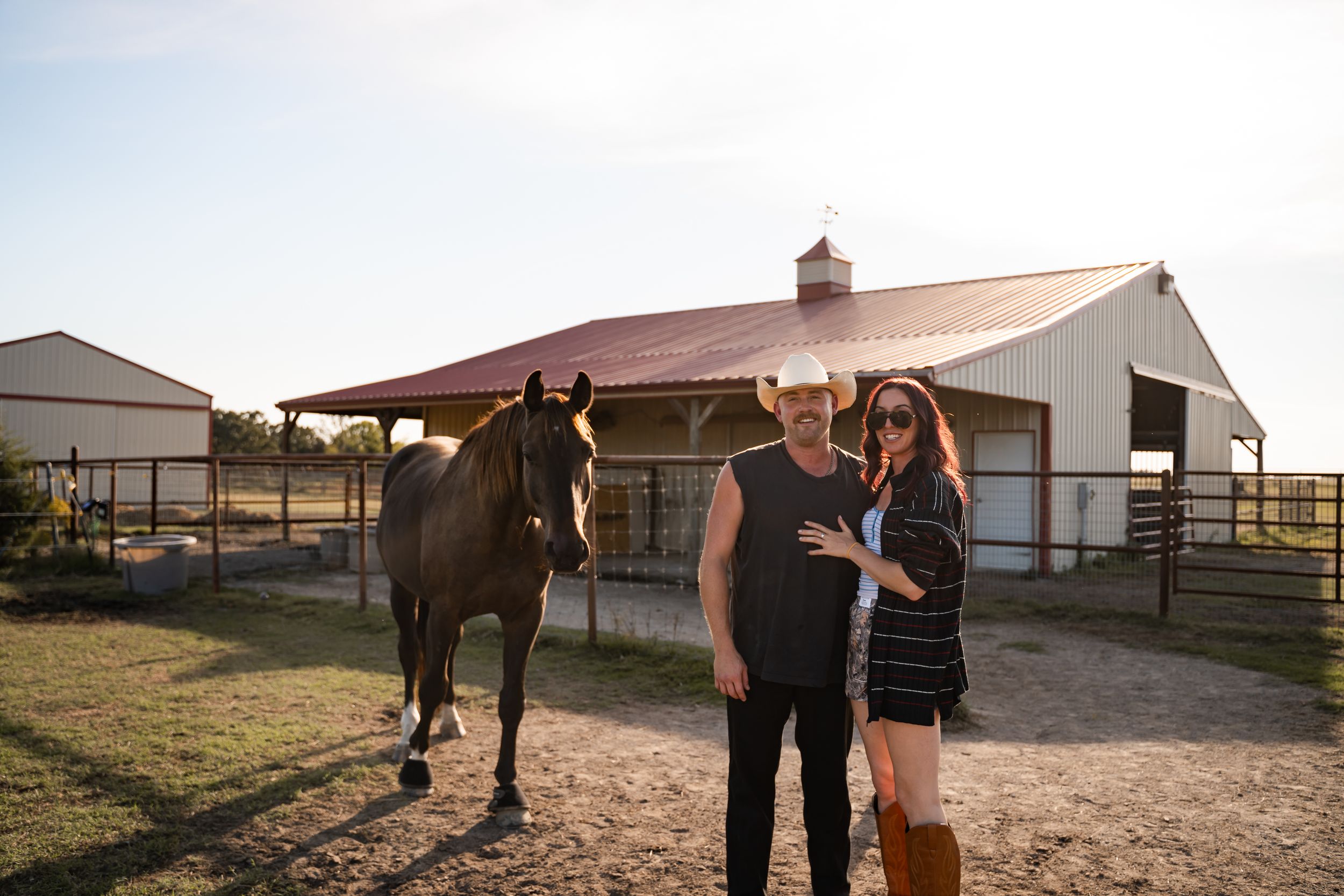 Tulsa photographer captures sweet couple embracing in front of their horses