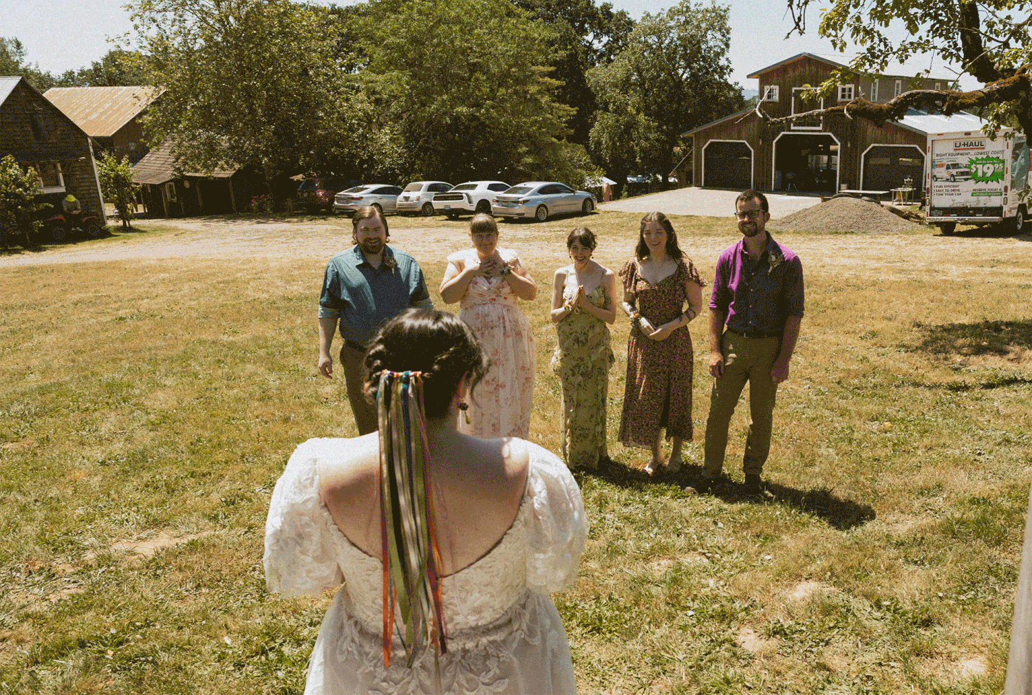 Bride giving her friends a first look of her wedding gown.