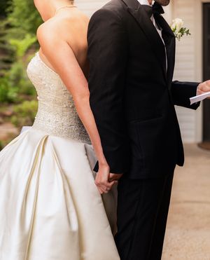 Bride and groom holding hands at wedding first touch. Reading vows. Little Wren Rockwall, Texas. Dallas Wedding. Fort Worth Wedding.