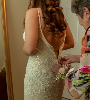 Back detail of an intricately beaded wedding dress being fastened. Fort Worth Texas Wedding. Dallas Texas Wedding. DFW Bride. Bridal Texas