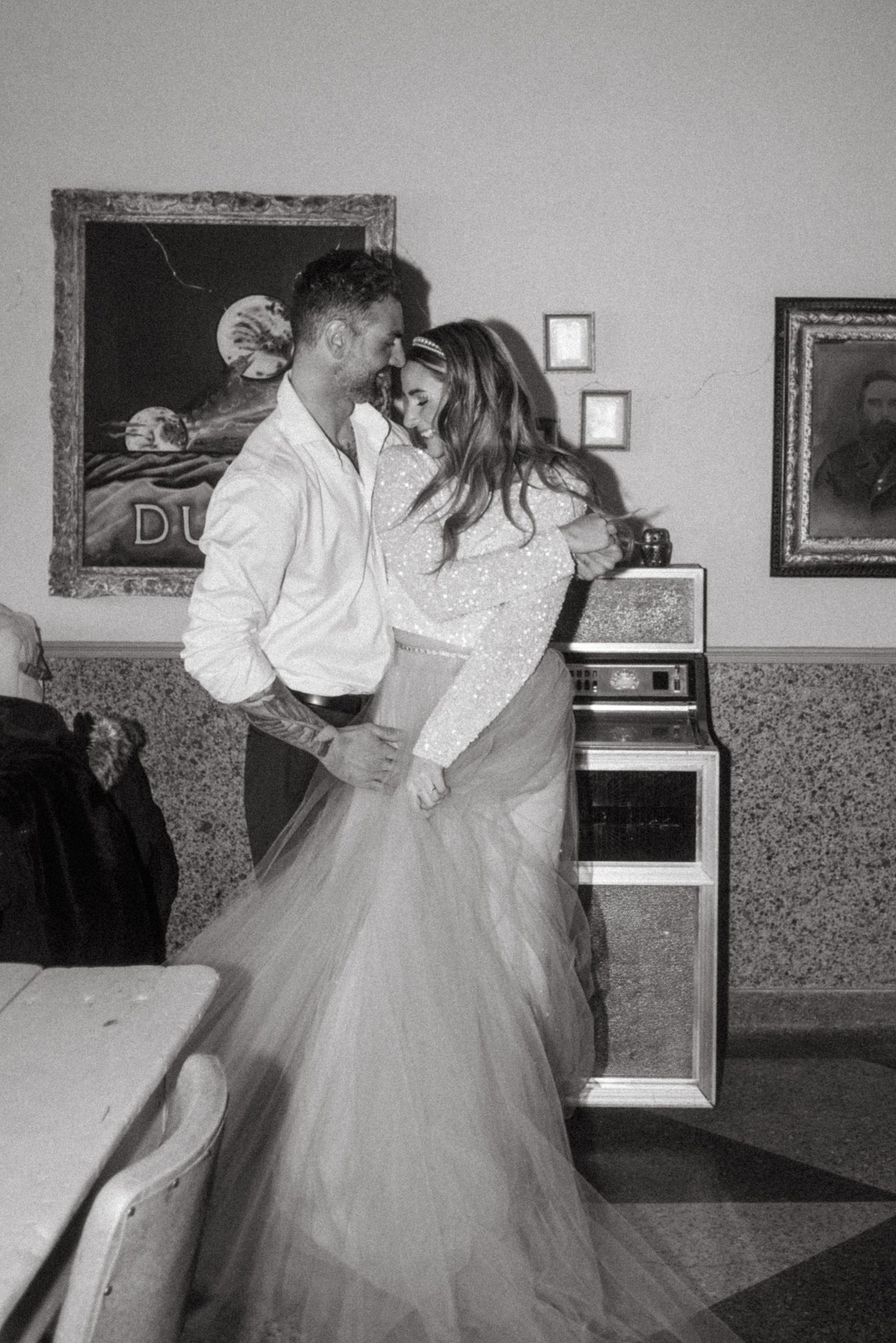 Romantic black and white photo in retro diner setting.