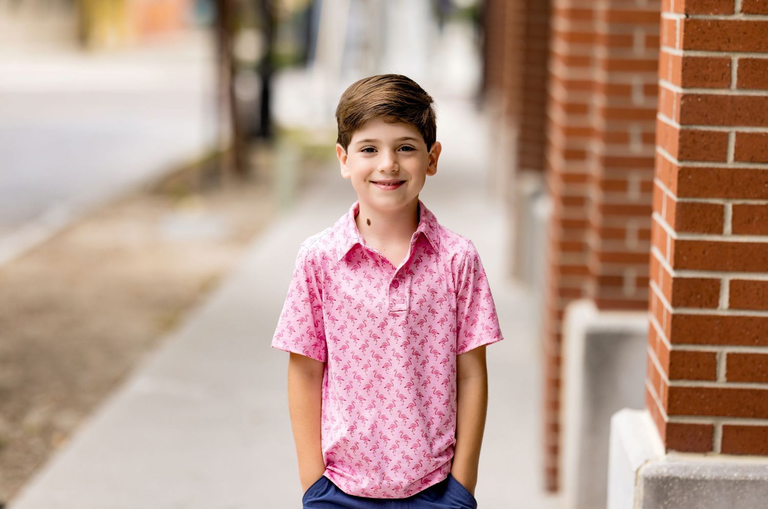 Series of casual outdoor portraits against classic red brick architecture.