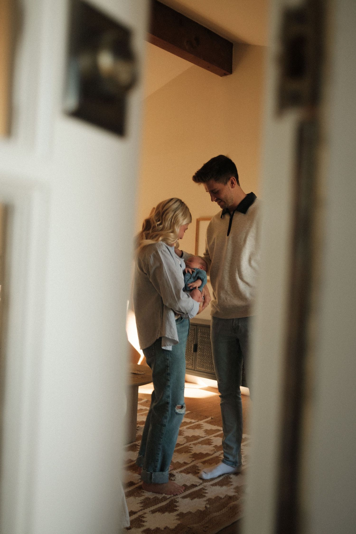 Blurred interior scene with soft lighting and people in casual attire.