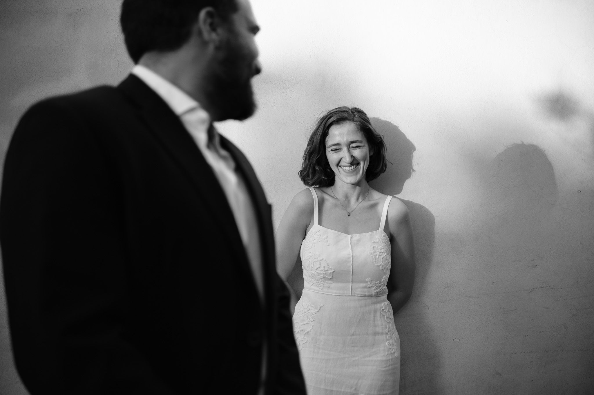 An intimate close-up silhouette of a tender romantic moment between two people in warm lighting.