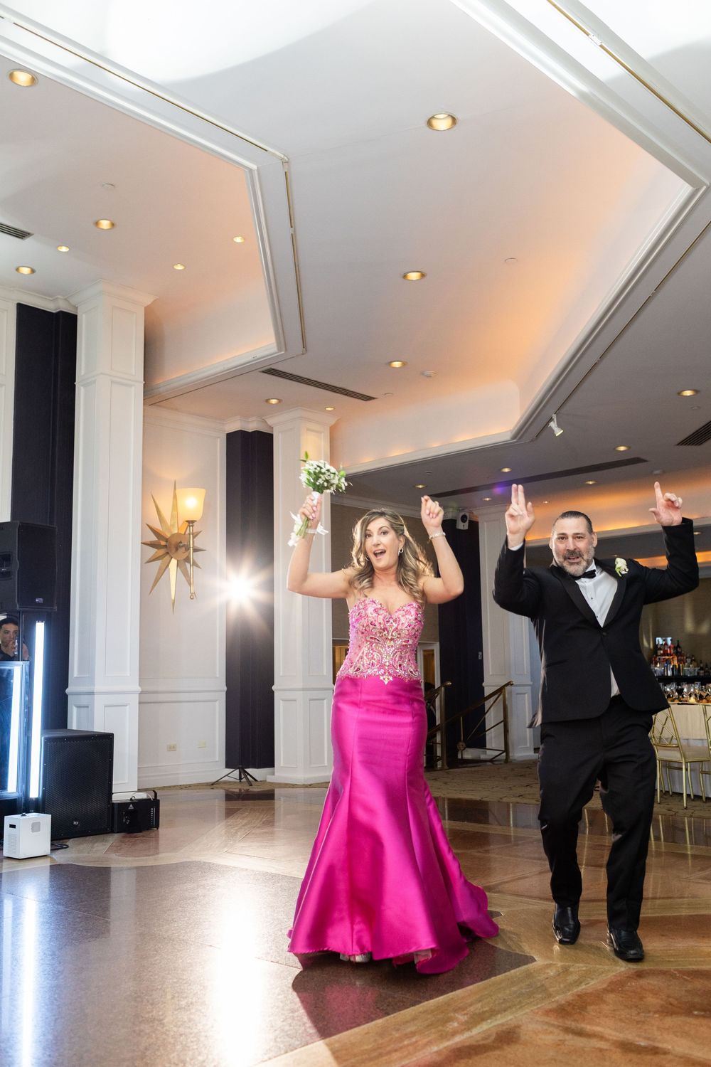 Parents of the groom making a lively entrance during a luxury wedding reception at Glen Island Harbour Club in New Rochelle, New York.