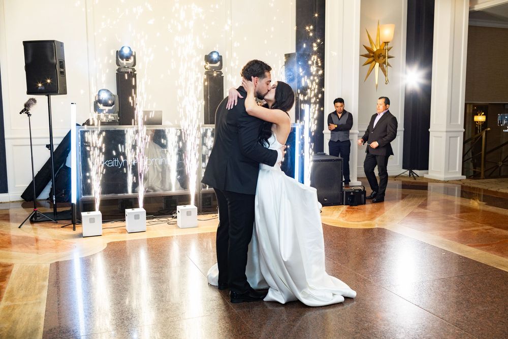 Romantic first dance with indoor sparkler effects during a luxury wedding reception at Glen Island Harbour Club.