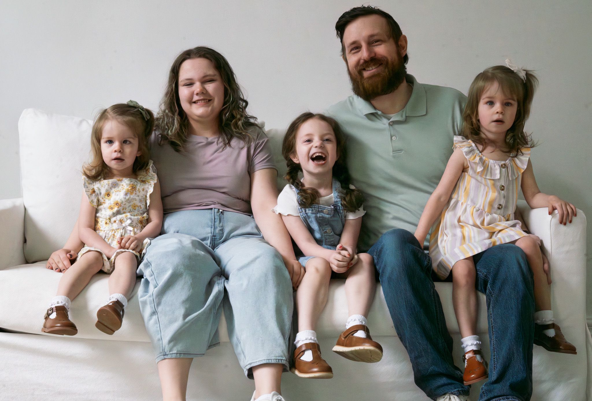 A dad with his daughters.