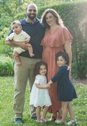 A family photo in a garden.