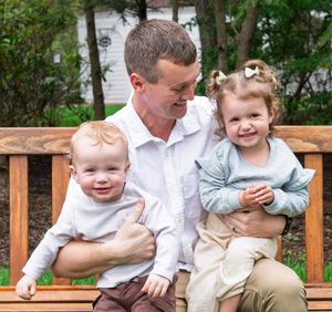A dad with his two kids.