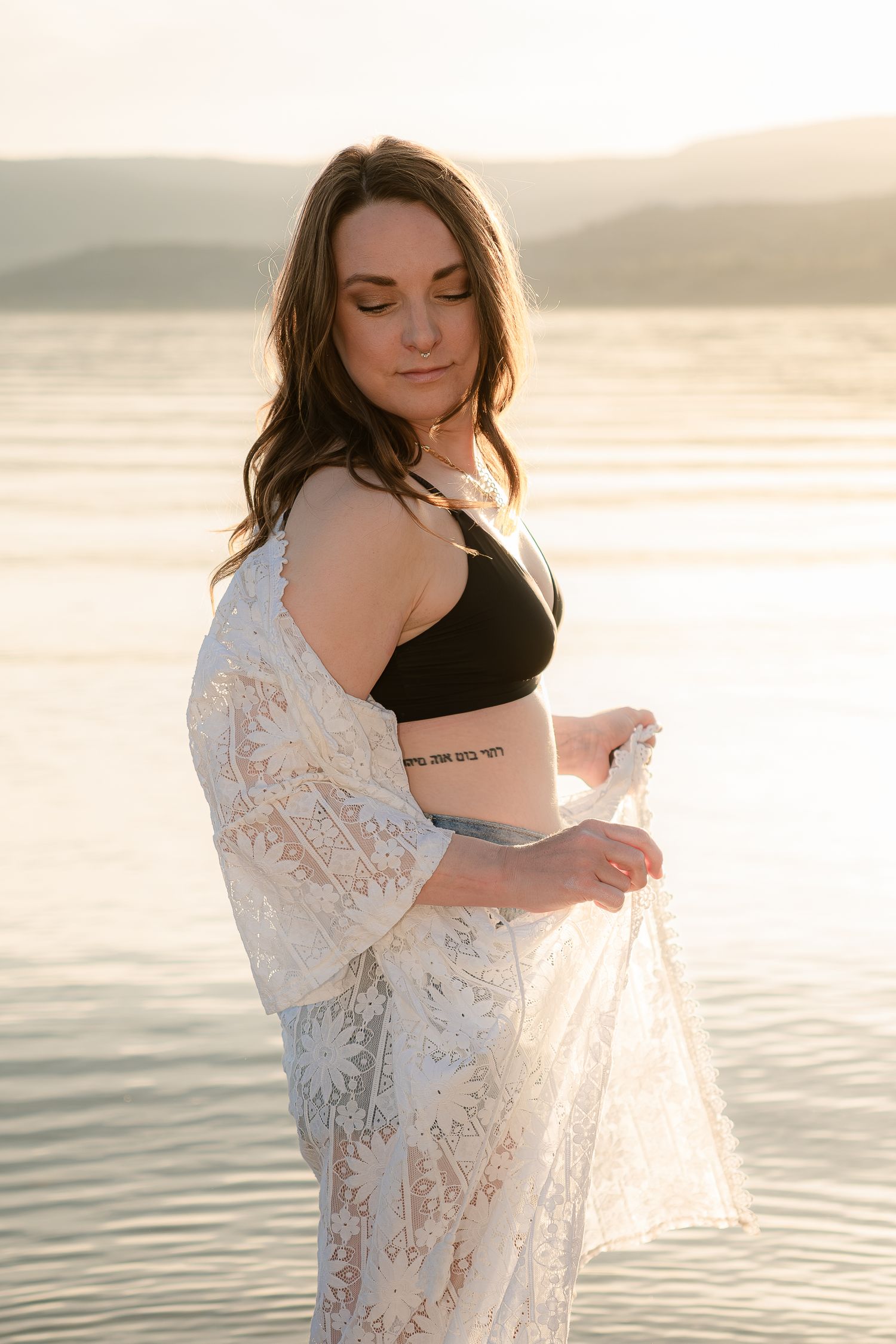 sunset, beach, woman in white shawl.