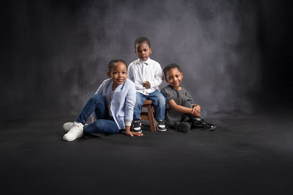 Sibling portrait session with timeless studio styling in Cumbernauld.