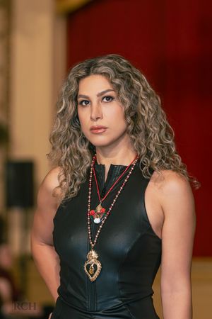 Editorial fashion portrait captured during a luxury runway showcase by Raymond C. Hansell Photography.