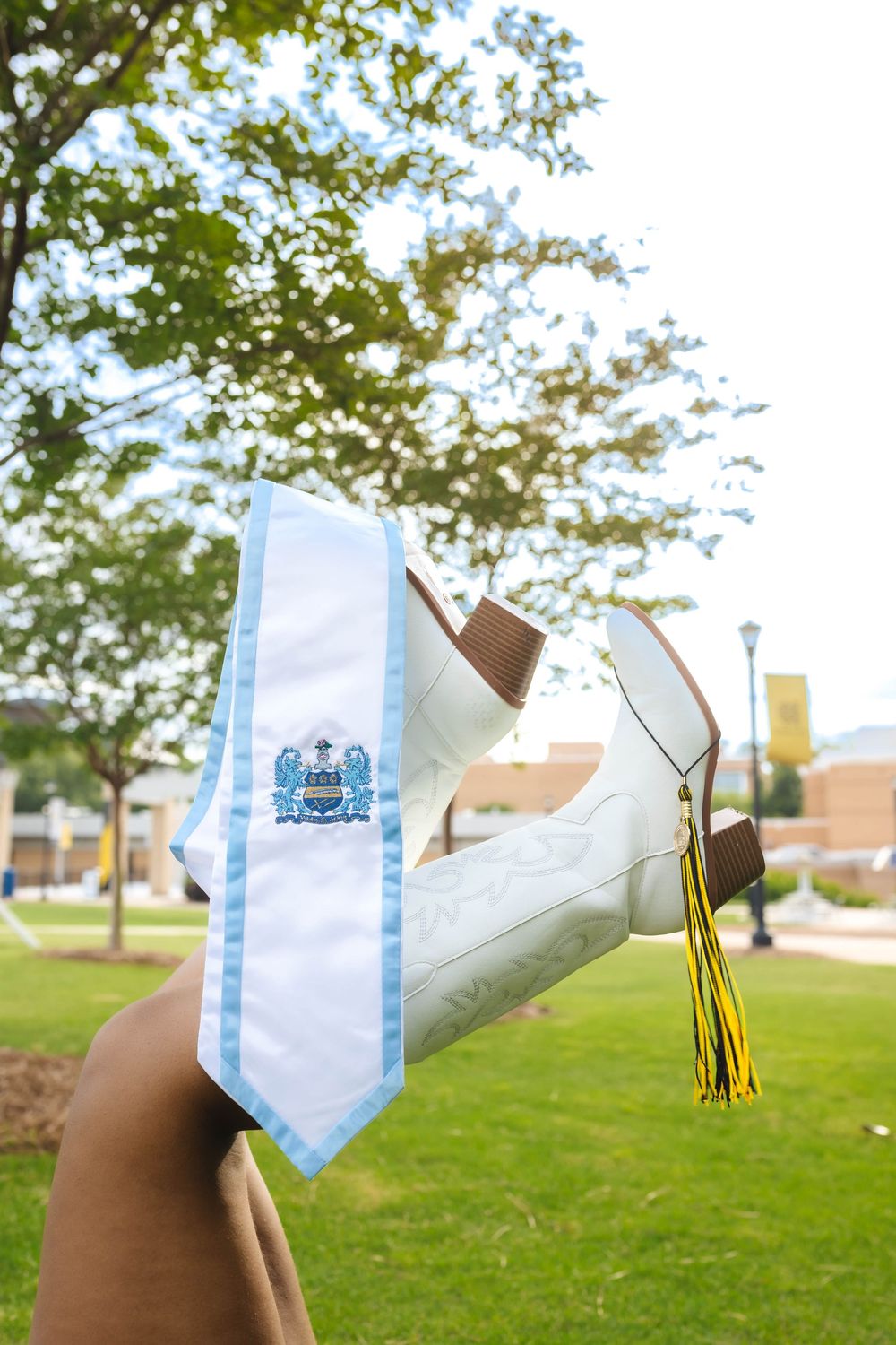 Shoes lifted in the air with tassels