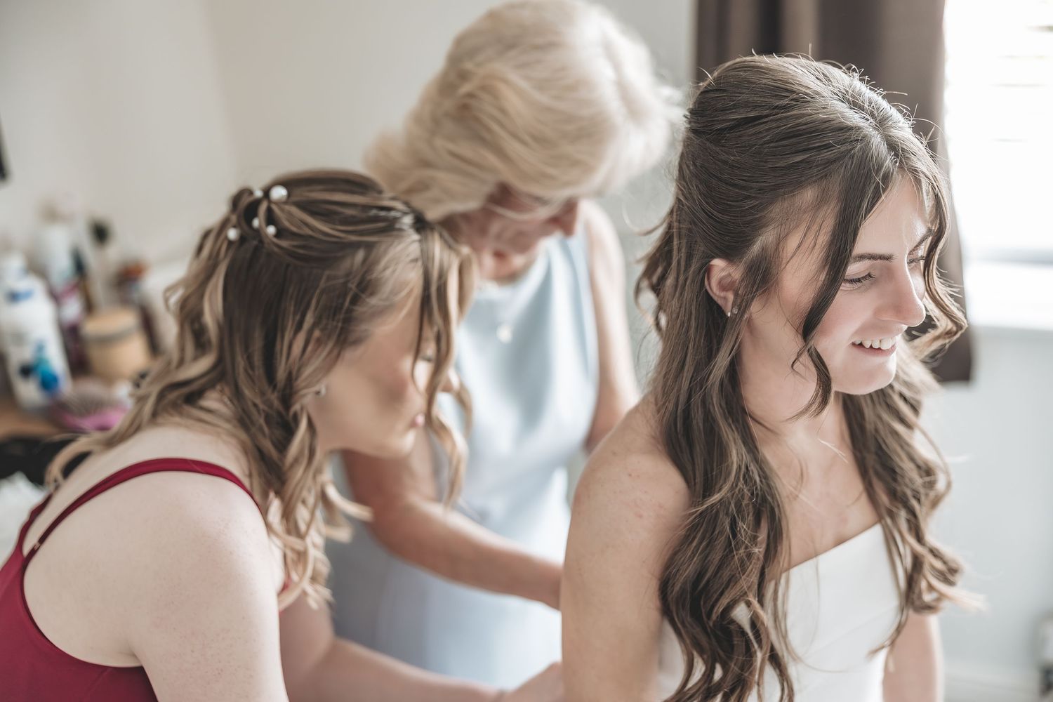 Natural wedding photo of bride getting ready at home in Beverley.