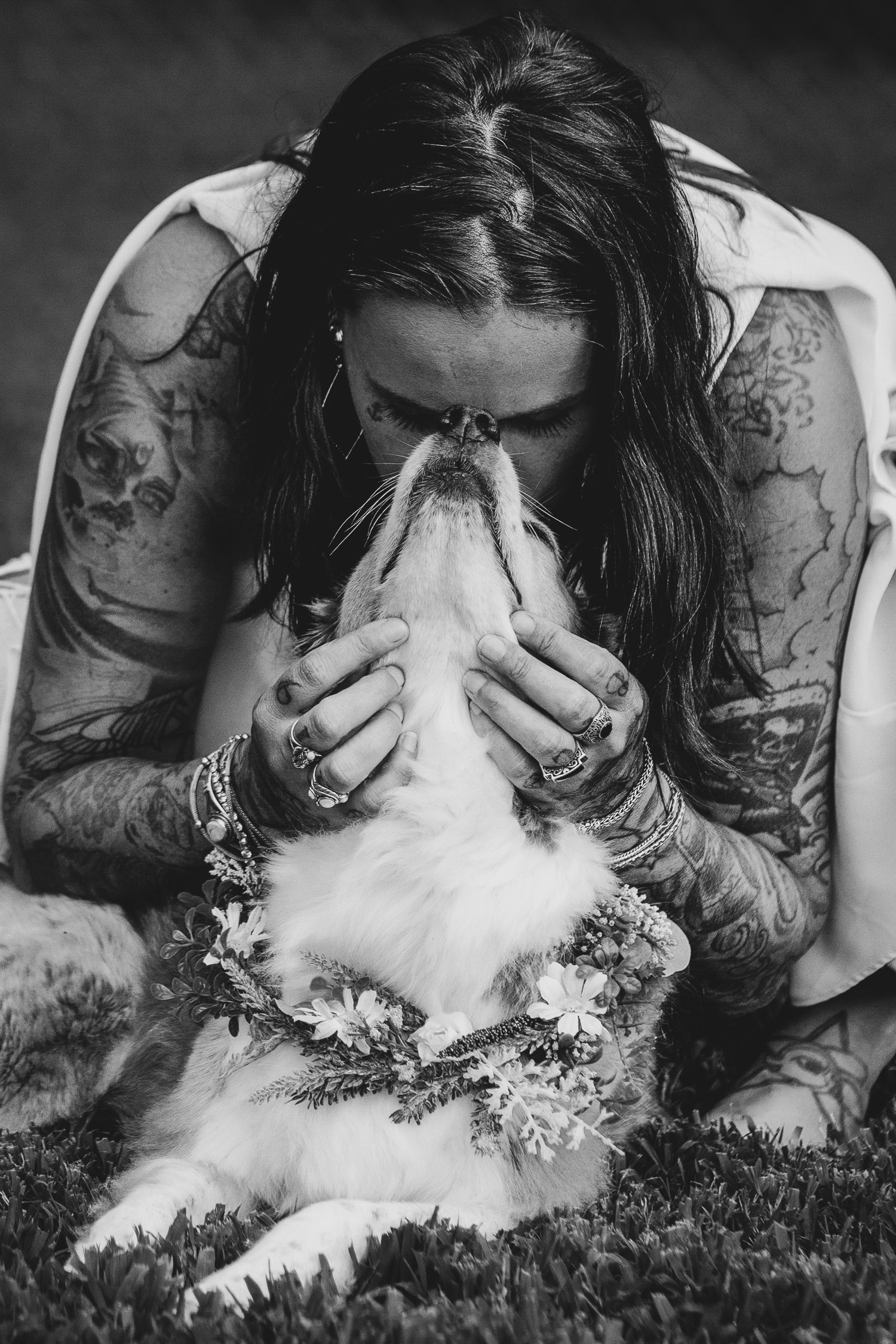 Emotional EOL session of owner hugging their senior dog outdoors, sharing a tender goodbye.