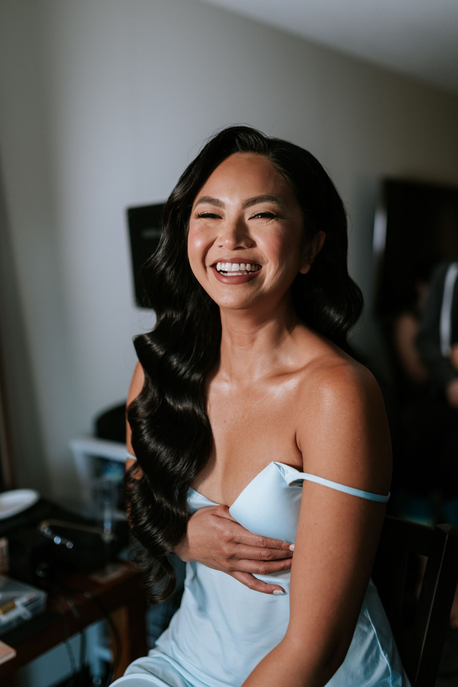 Elegant bridal preparation moment captured in natural light.