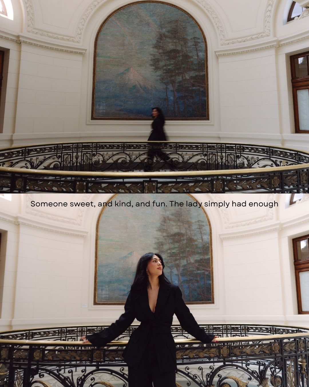 Woman in black suit posing on grand staircase with large landscape painting backdrop.
