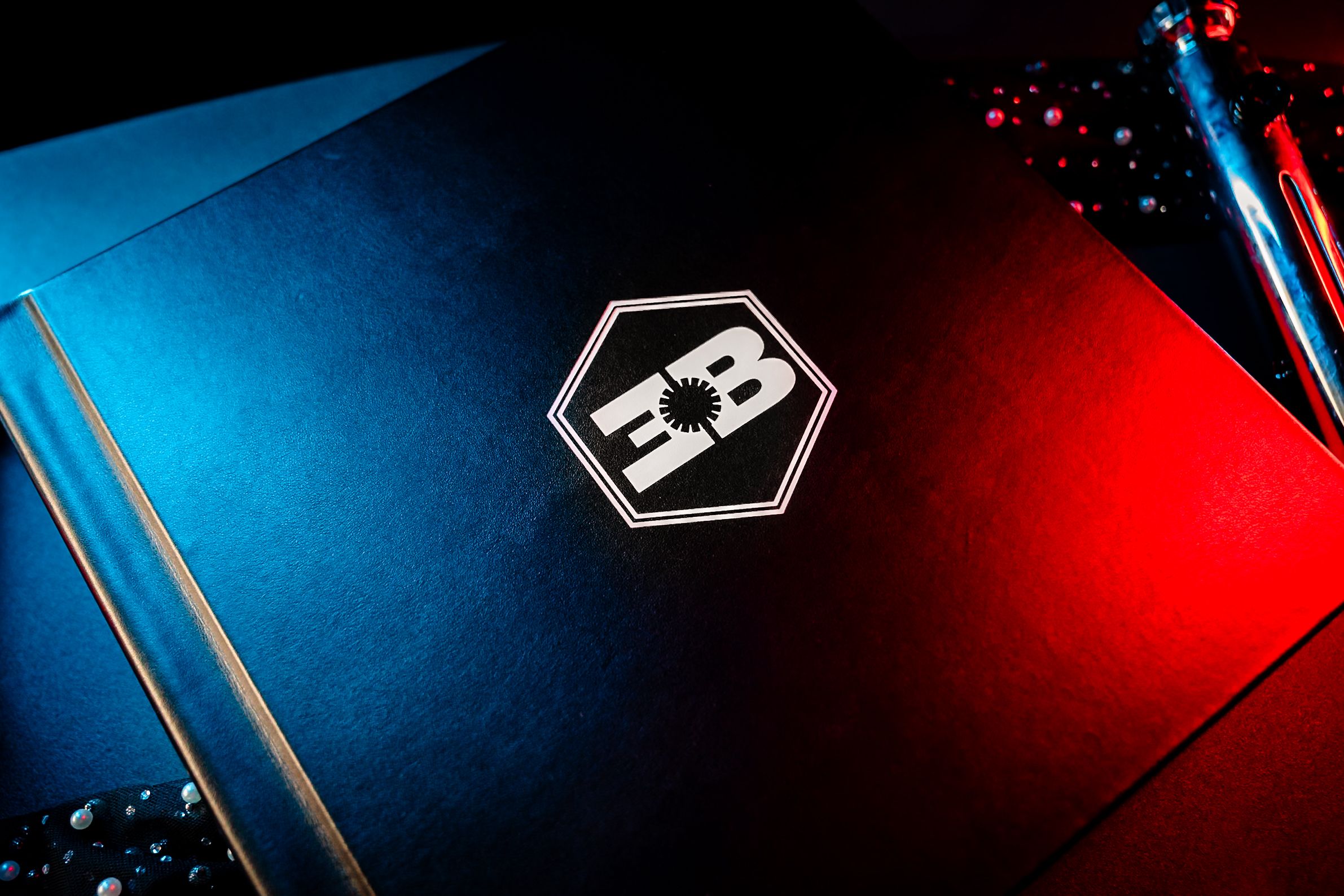 Minimalist design scene featuring dramatic red and blue lighting with geometric elements.
