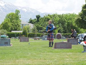 A piper plays hymns on the bagpipes
