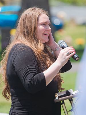 A woman laughs while telling stories about her mom
