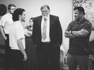 The son, uncle and friend of the departed talk together