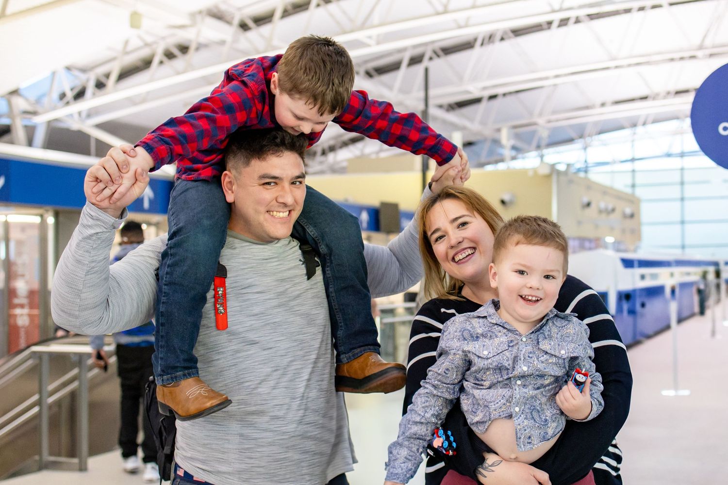 Central Illinois photographer captures a joyful family during a military homecoming photo session in St. Louis, MO.